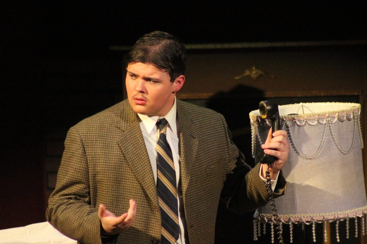Junior Jacob Whitworth as lead character Richard Hannay in "The 39 Steps".